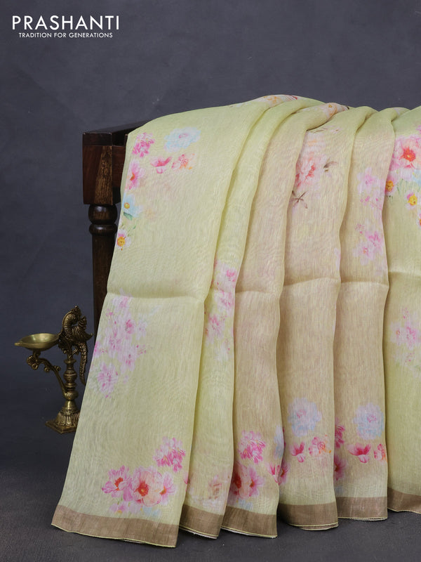 Pure linen silk saree mild pista green and pink shade with floral butta prints and small zari woven border