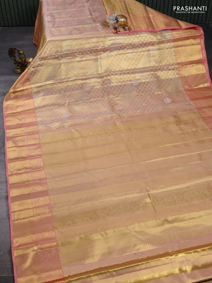 Pure kanchipuram tissue silk saree mild peach and peach with allover silver zari woven brocade weaves and rich zari woven border