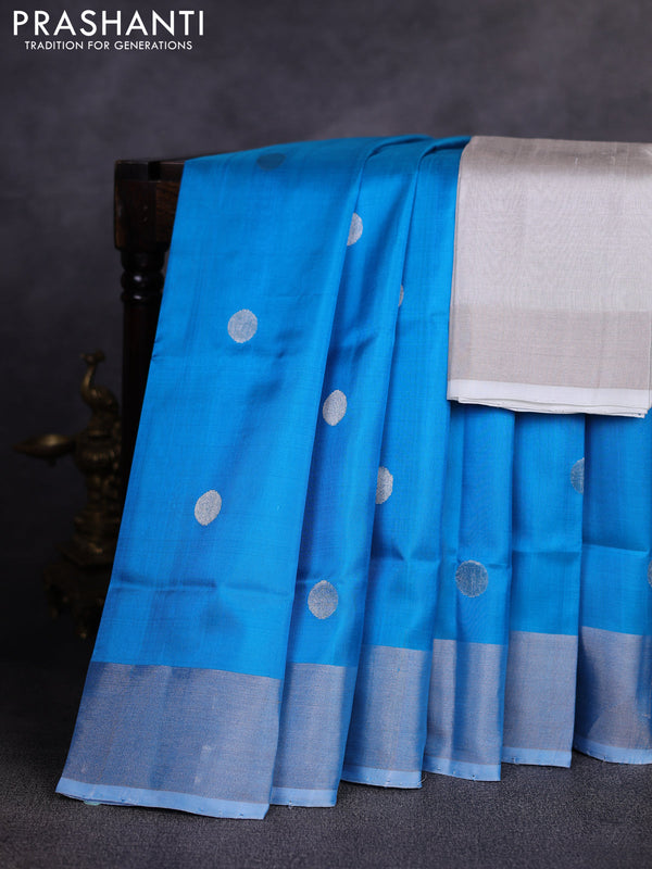 Pure uppada silk saree cs blue with allover silver zari woven coin buttas and zari woven border