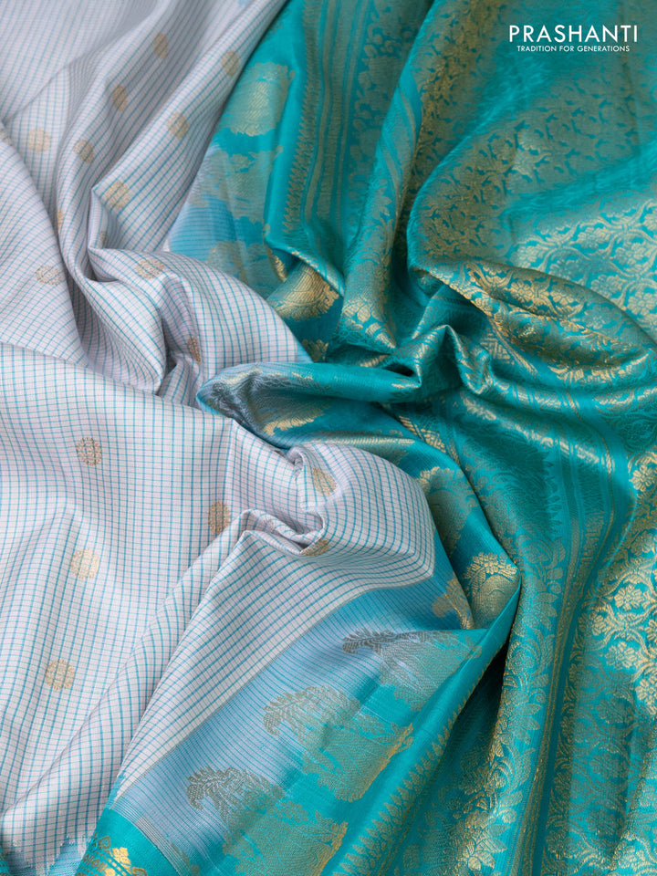 Pure gadwal silk saree cream and teal blue with allover small checks & zari buttas and temple design zari woven border