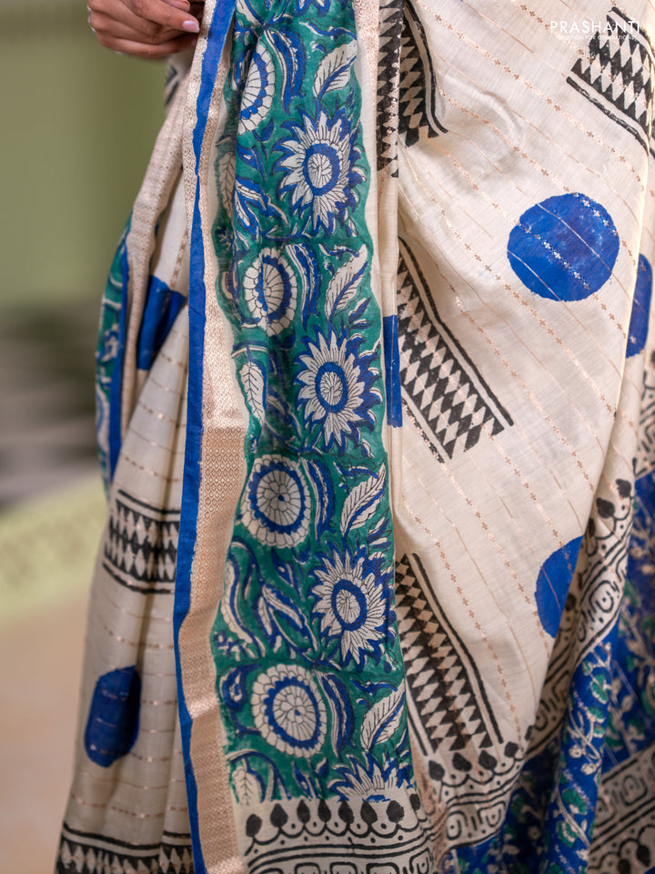 Semi chanderi saree cream and green with allover zari weaves & geometric block prints and long printed border