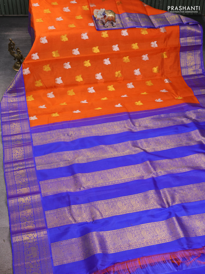 Kora kanchipuram silk saree orange and blue with allover silver & gold zari woven buttas and zari woven korvai border