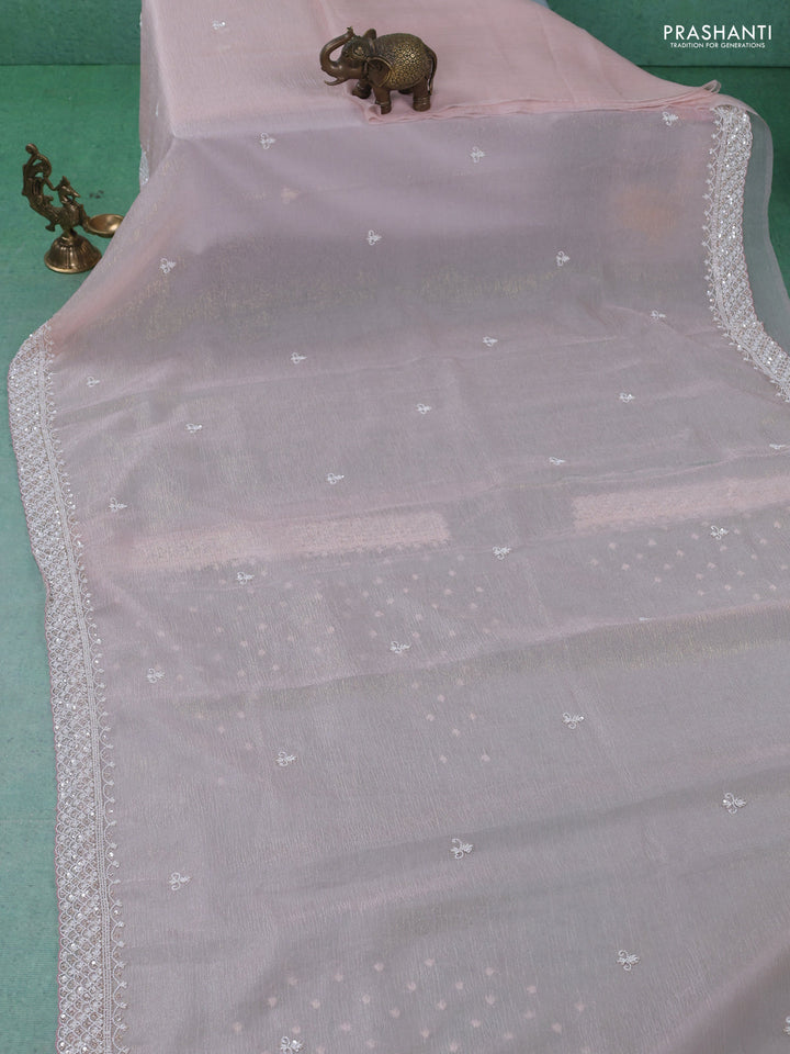 Crush tissue saree pastel peach with beaded work and sequin & cut beaded work border