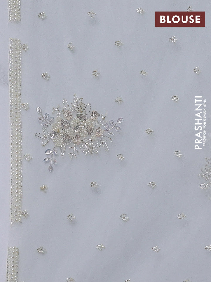 Organza silk saree off white with allover floral embroidery sequin work and beaded work border