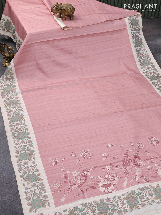 Tussar silk saree peach pink and cream with allover zari buttas and floral design cross stitched embroidery border