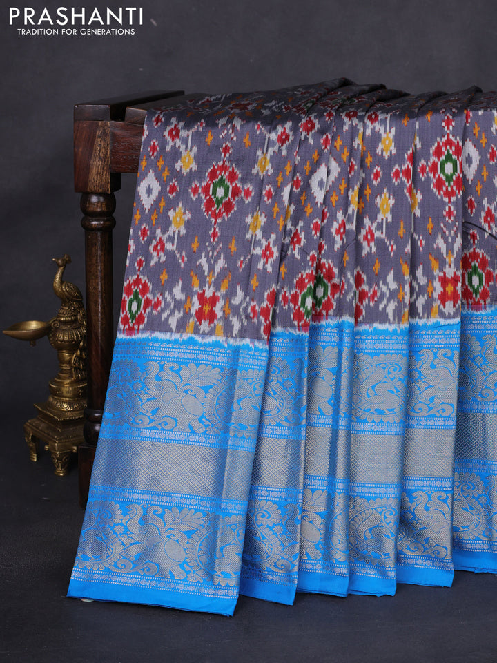 Pochampally silk saree grey and cs blue with allover ikat weaves and long silver & gold zari woven border