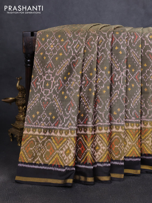 Rajkot patola silk saree elachi green and black with allover ikat weaves and zari woven border