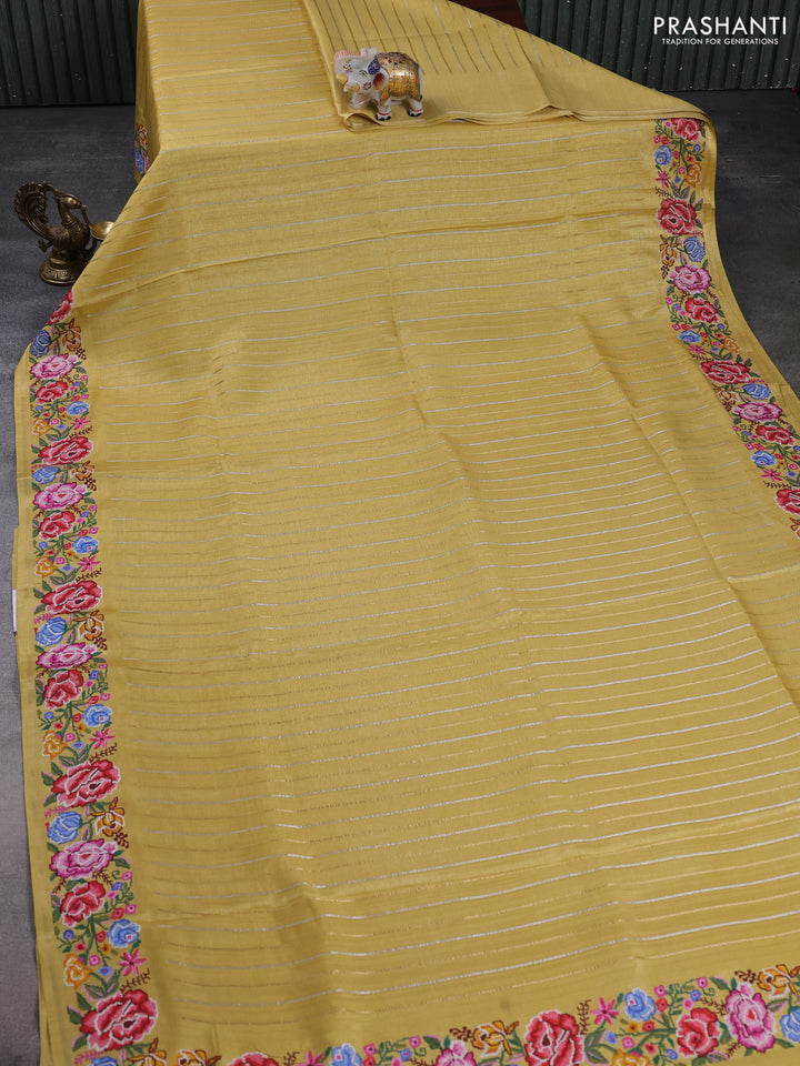 Semi tussar saree yellow with allover zari stripe pattern and floral embroidery border