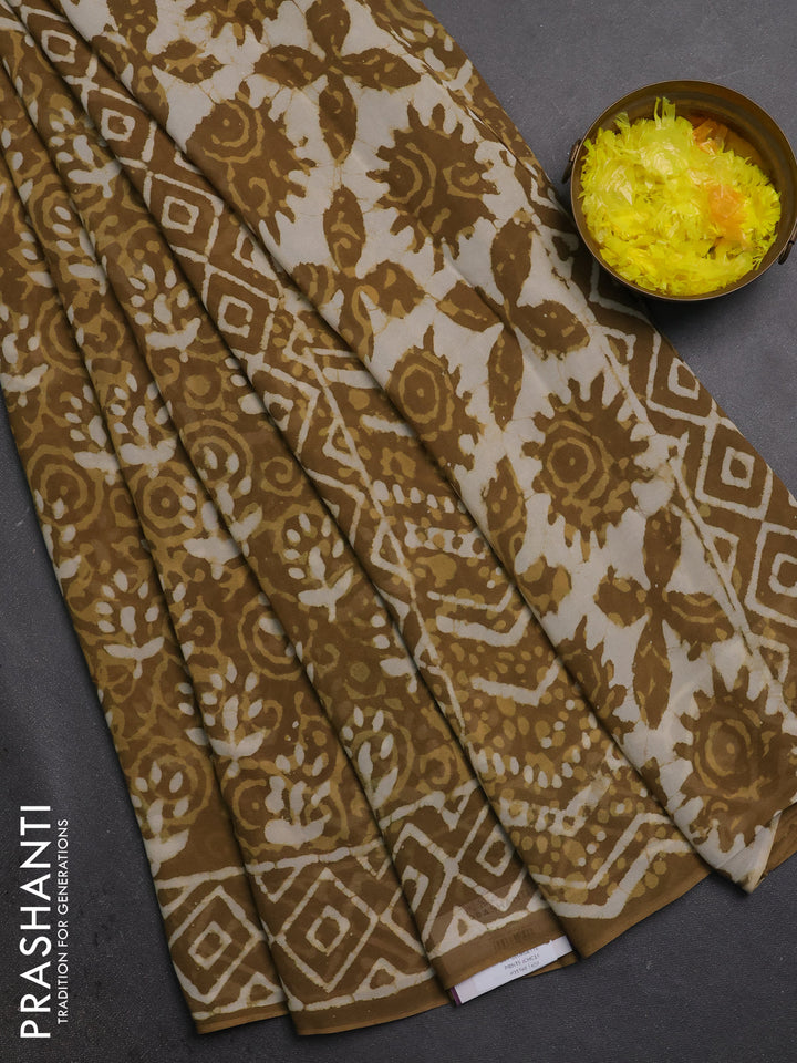 Georgette saree khaki shade with allover dabu prints and printed border