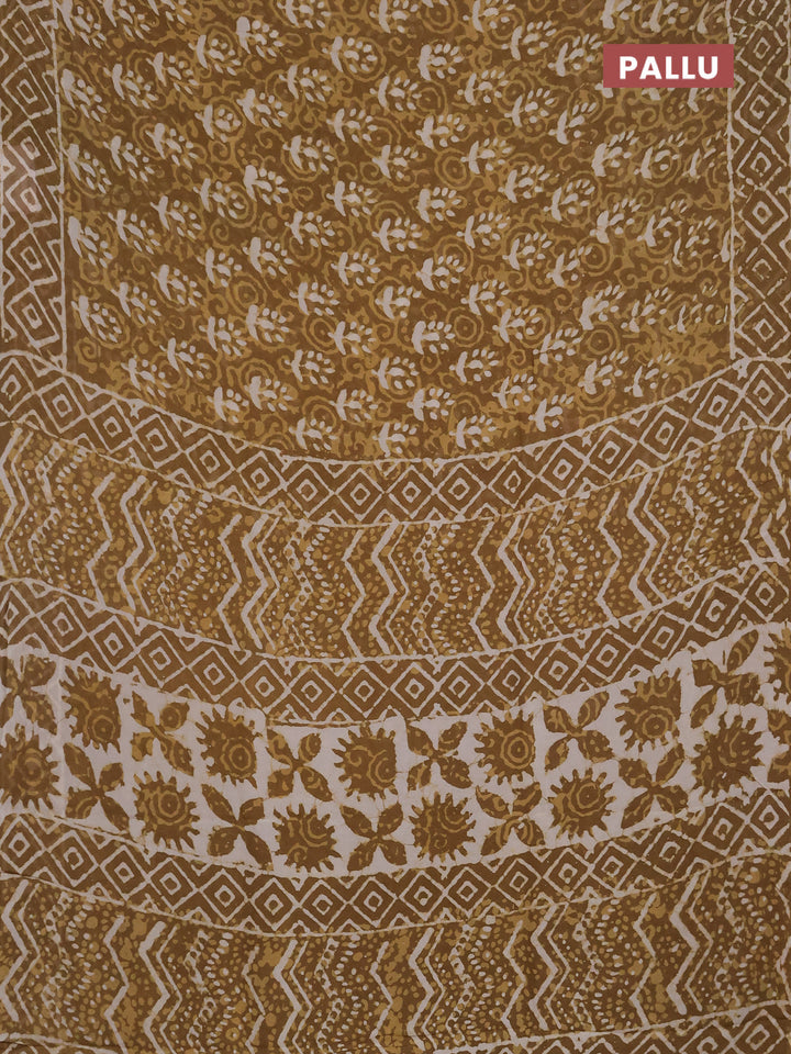 Georgette saree khaki shade with allover dabu prints and printed border