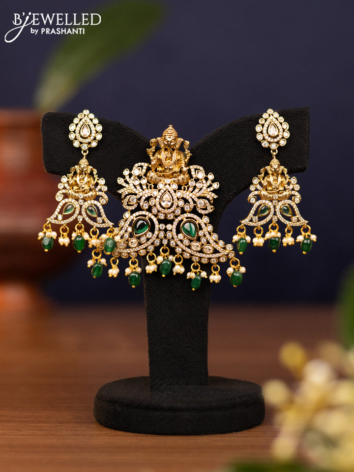 Pendant sets ganesha design with emerald & cz stones and pearl & beads hangings in victorian finish