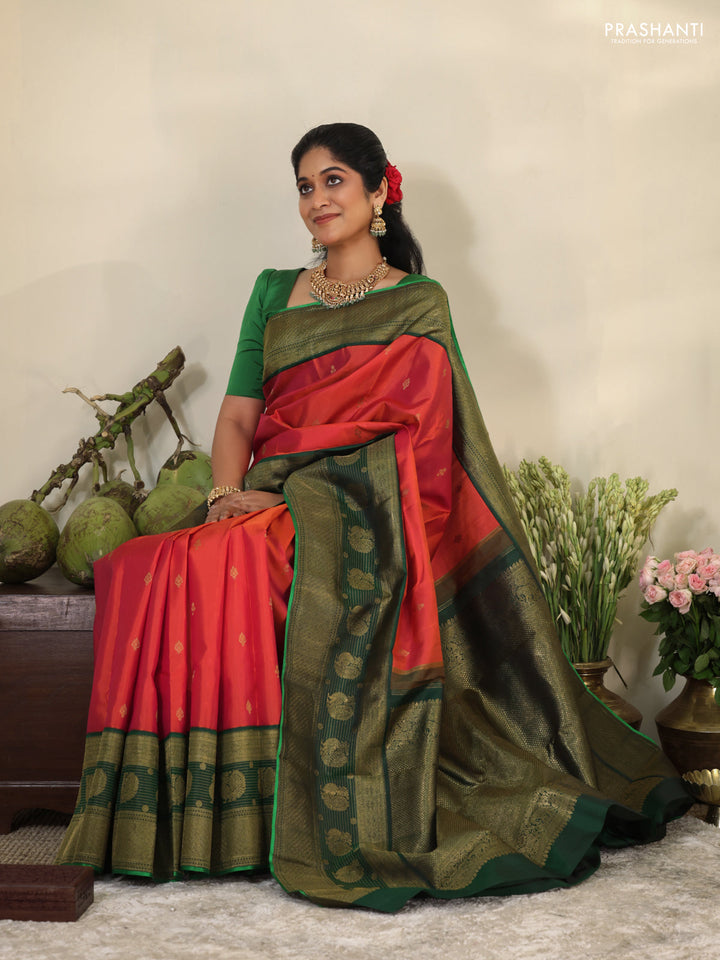 Pinkish orange-Green Pure kanchipuram silk saree with zari woven buttas & long zari woven border