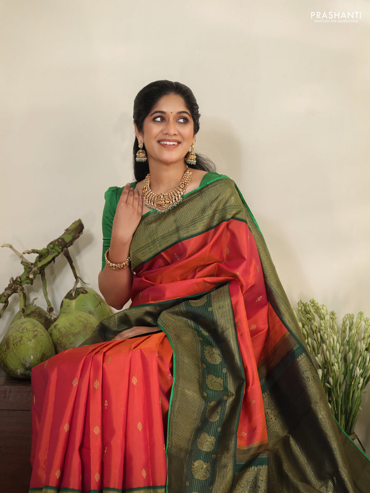 Pinkish orange-Green Pure kanchipuram silk saree with zari woven buttas & long zari woven border