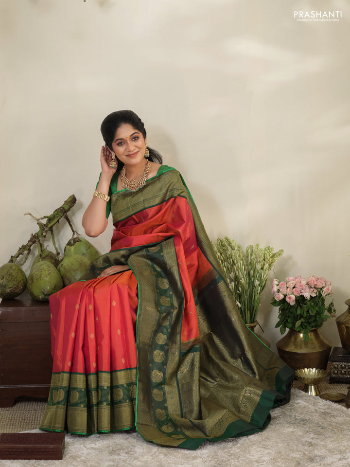 Pinkish orange-Green Pure kanchipuram silk saree with zari woven buttas & long zari woven border