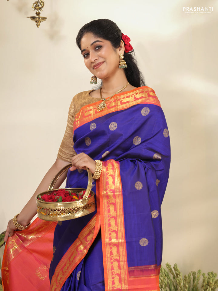 Blue-Dual shade of pinkish orange pure kanchipuram silk saree with zari woven buttas & zari woven border