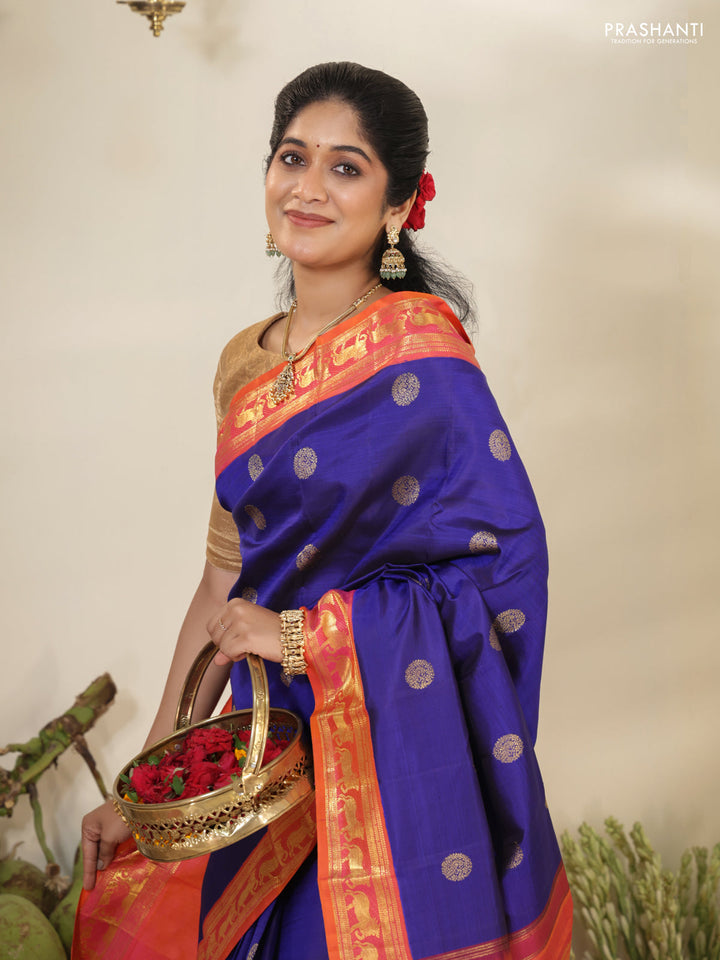 Blue-Dual shade of pinkish orange pure kanchipuram silk saree with zari woven buttas & zari woven border
