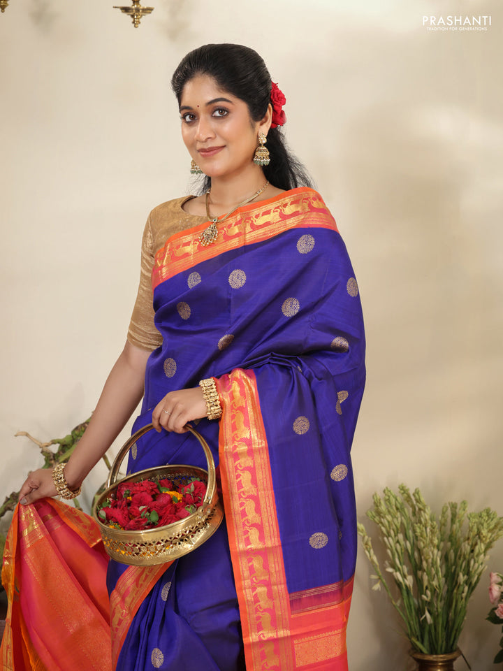 Blue-Dual shade of pinkish orange pure kanchipuram silk saree with zari woven buttas & zari woven border