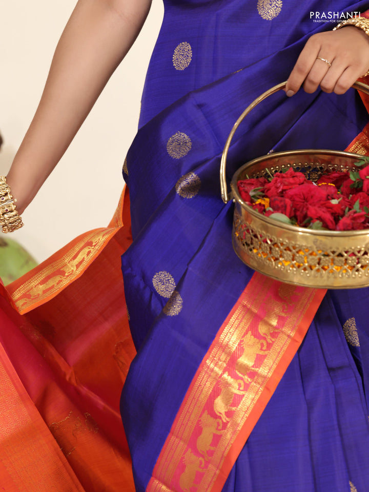 Blue-Dual shade of pinkish orange pure kanchipuram silk saree with zari woven buttas & zari woven border