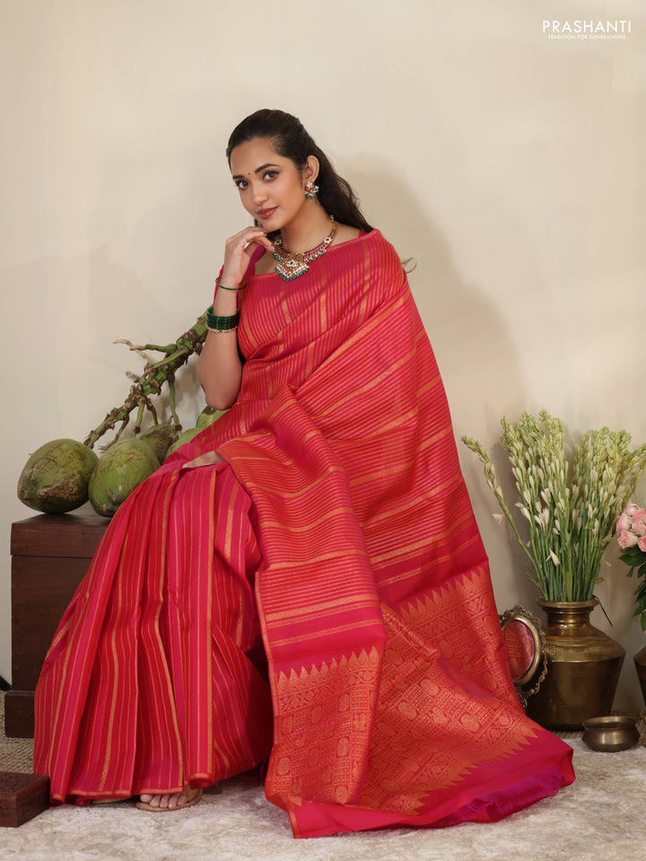 Pink pure kanchipuram silk saree with allover zari stripes pattern & in borderless style