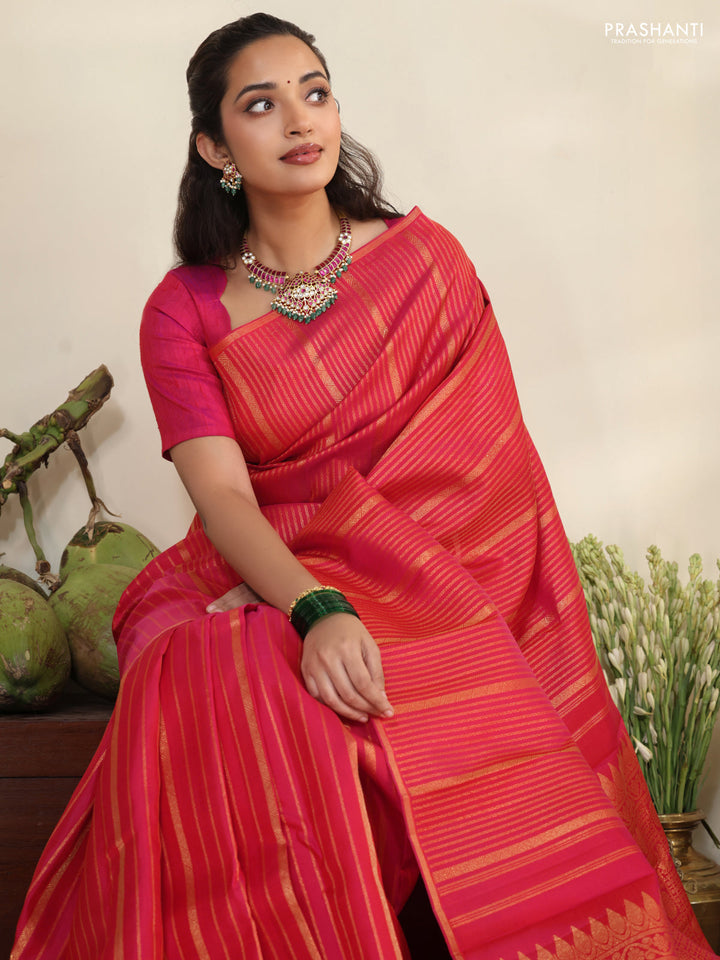 Pink pure kanchipuram silk saree with allover zari stripes pattern & in borderless style
