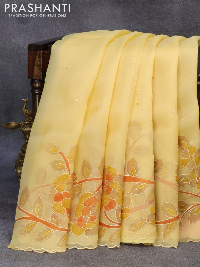 Pure organza silk saree yellow with allover mirror embroidery work and long floral design embroidery work border