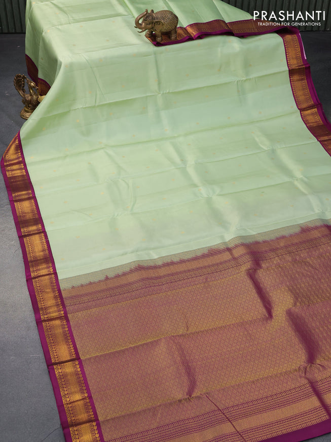 Pure kanjivaram silk saree pista green and purple with zari woven buttas and zari woven korvai border
