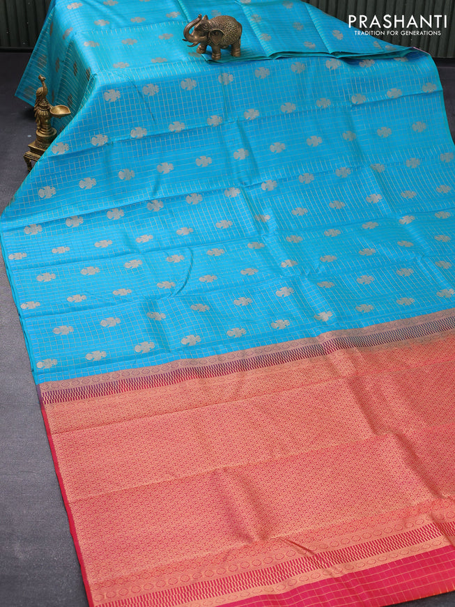 Pure kanjivaram silk saree dual shade of teal blue and dual shade of pinkish orange with allover zari checks & peacock buttas in borderless style