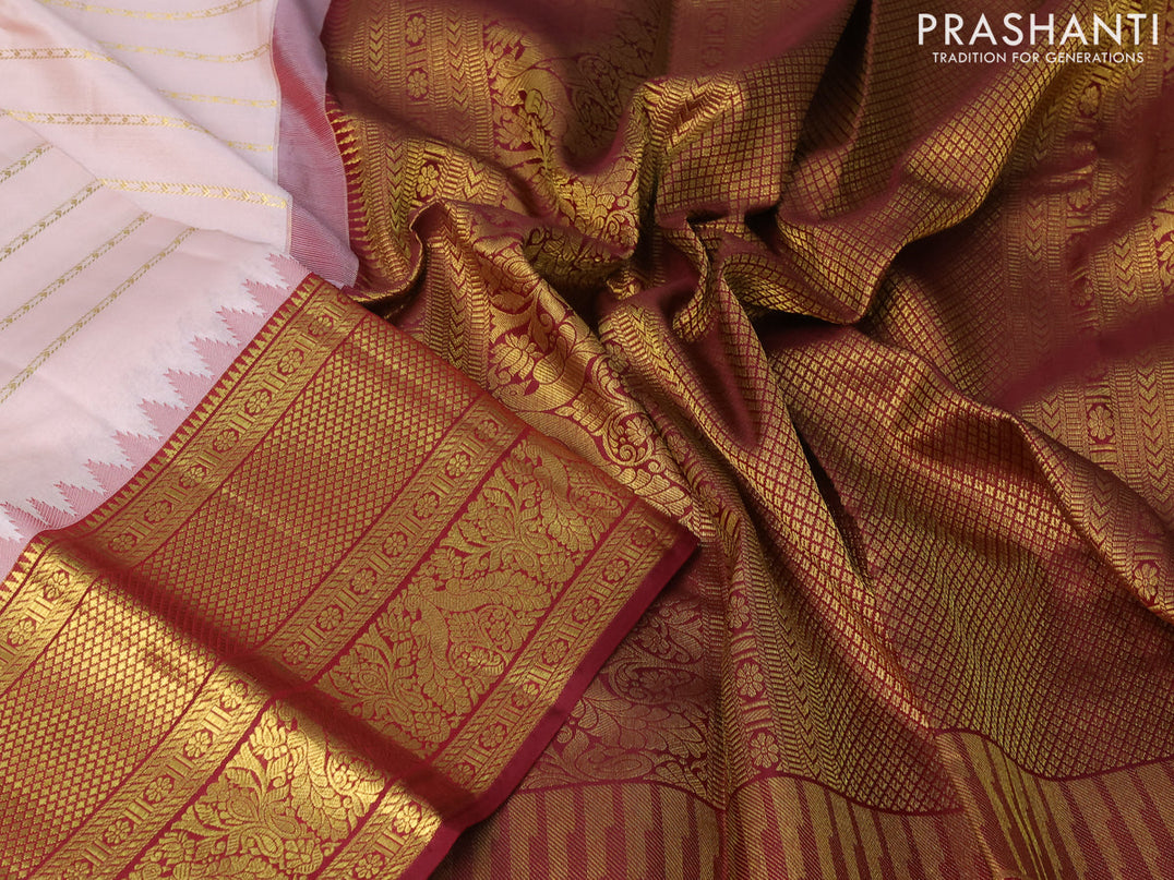 Pure kanjivaram silk saree peach shade and maroon with allover zari wove stripes pattern and temple woven long zari woven border