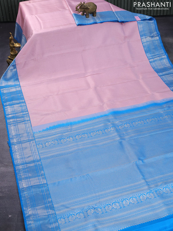 Pure kanjivaram silk saree light pink and cs blue with allover silver zari woven brocade weaves and silver zari woven border