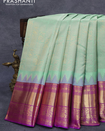 Pure kanjivaram silk saree pastel blue shade and purple with allover zari woven brocade weaves and zari woven floral border