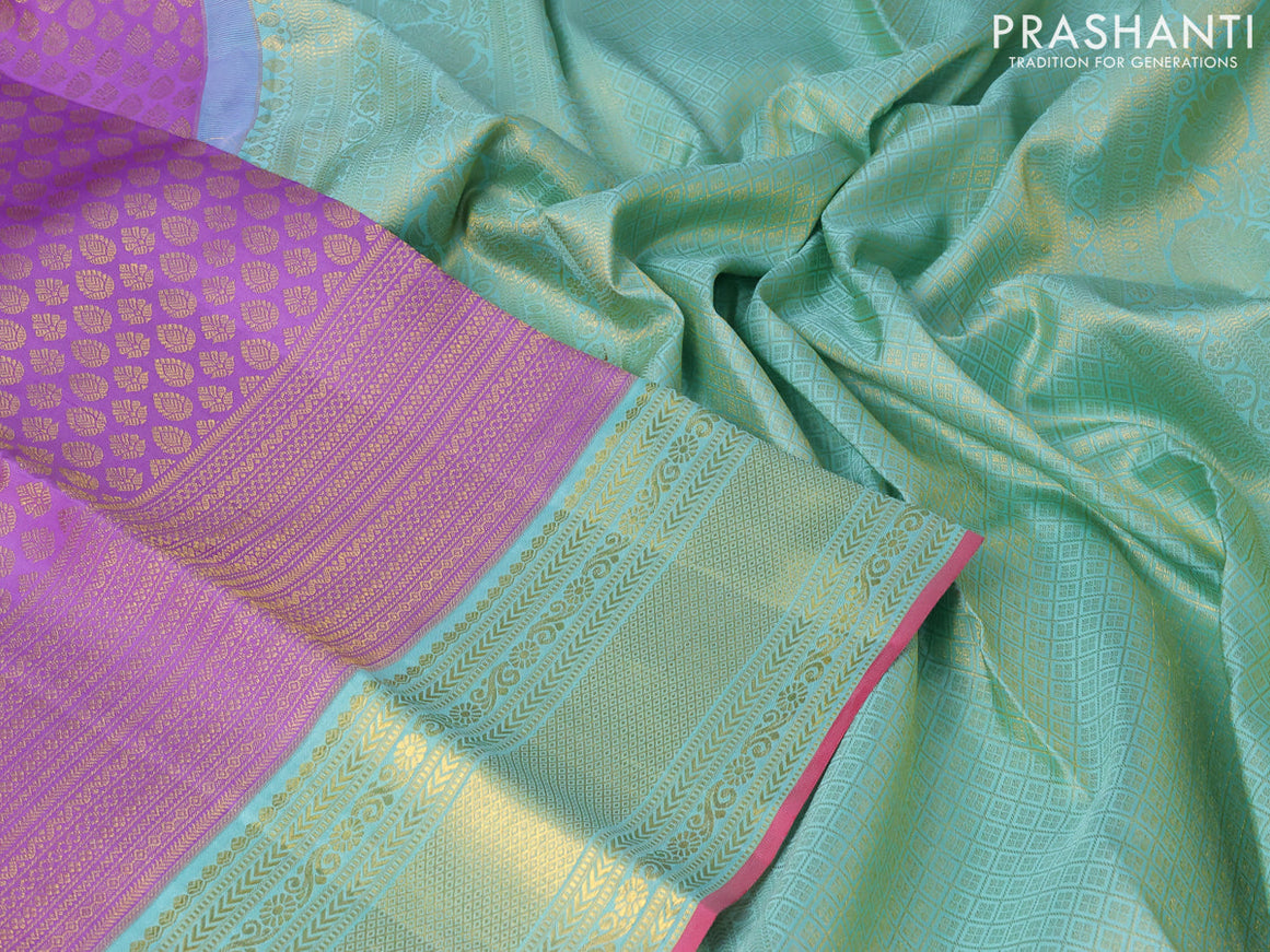 Pure kanjivaram silk saree lavender shade and teal blue shade with allover zari woven butta weaves and zari woven border