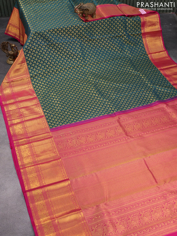 Pure kanjivaram silk saree peacock green and pink with allover zari woven butta weaves and long zari woven annam border