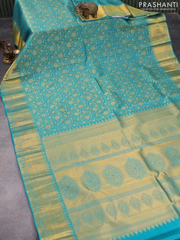 Pure kanjivaram silk saree teal blue with allover zari woven brocade weaves and rich zari woven border