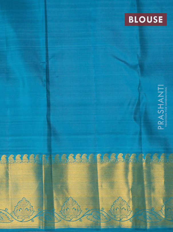 Pure kanjivaram silk saree teal blue with allover zari woven brocade weaves and rich zari woven border
