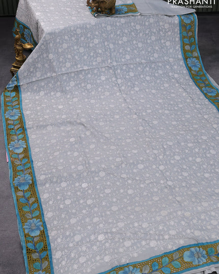 Pure tussar silk saree grey shade and blue with allover lucknowi work and kalamkari printed cut work border