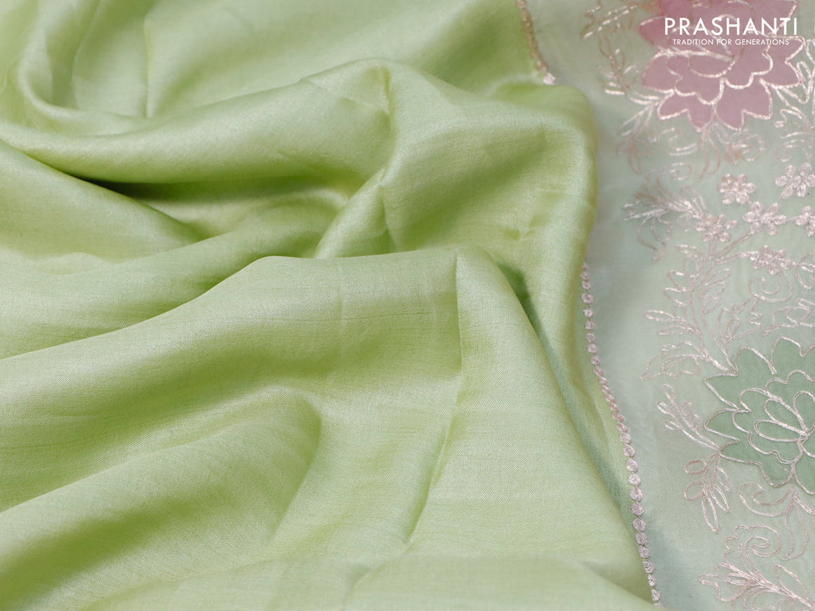 Pure tussar silk saree pista green and off white with plain body and organza embroidery work border
