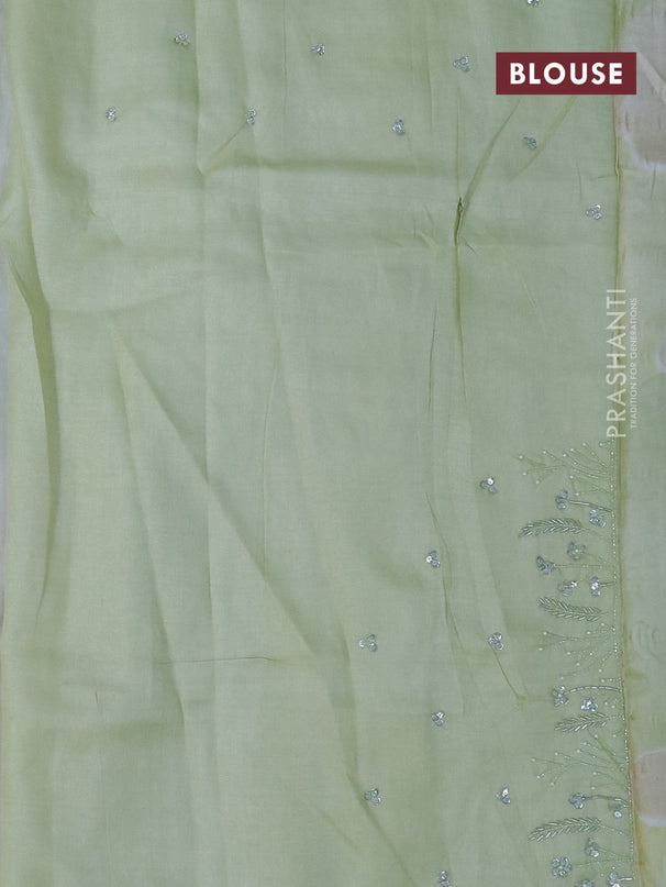 Pure tussar silk saree cream and pista green with sequin work buttas and beaded work border