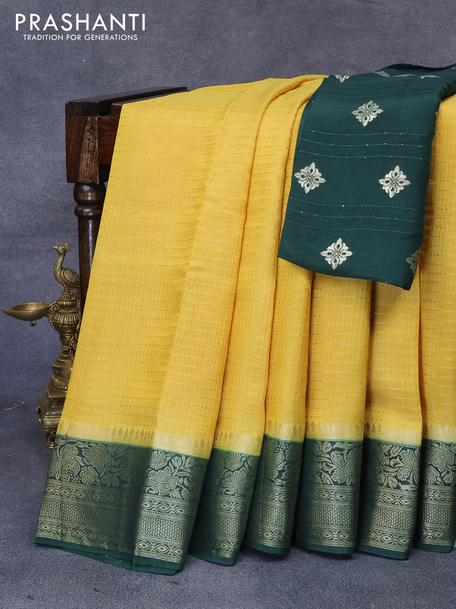 Dola silk saree yellow and bottle green with allover zari stripe weaves and zari woven border & zari butta blouse