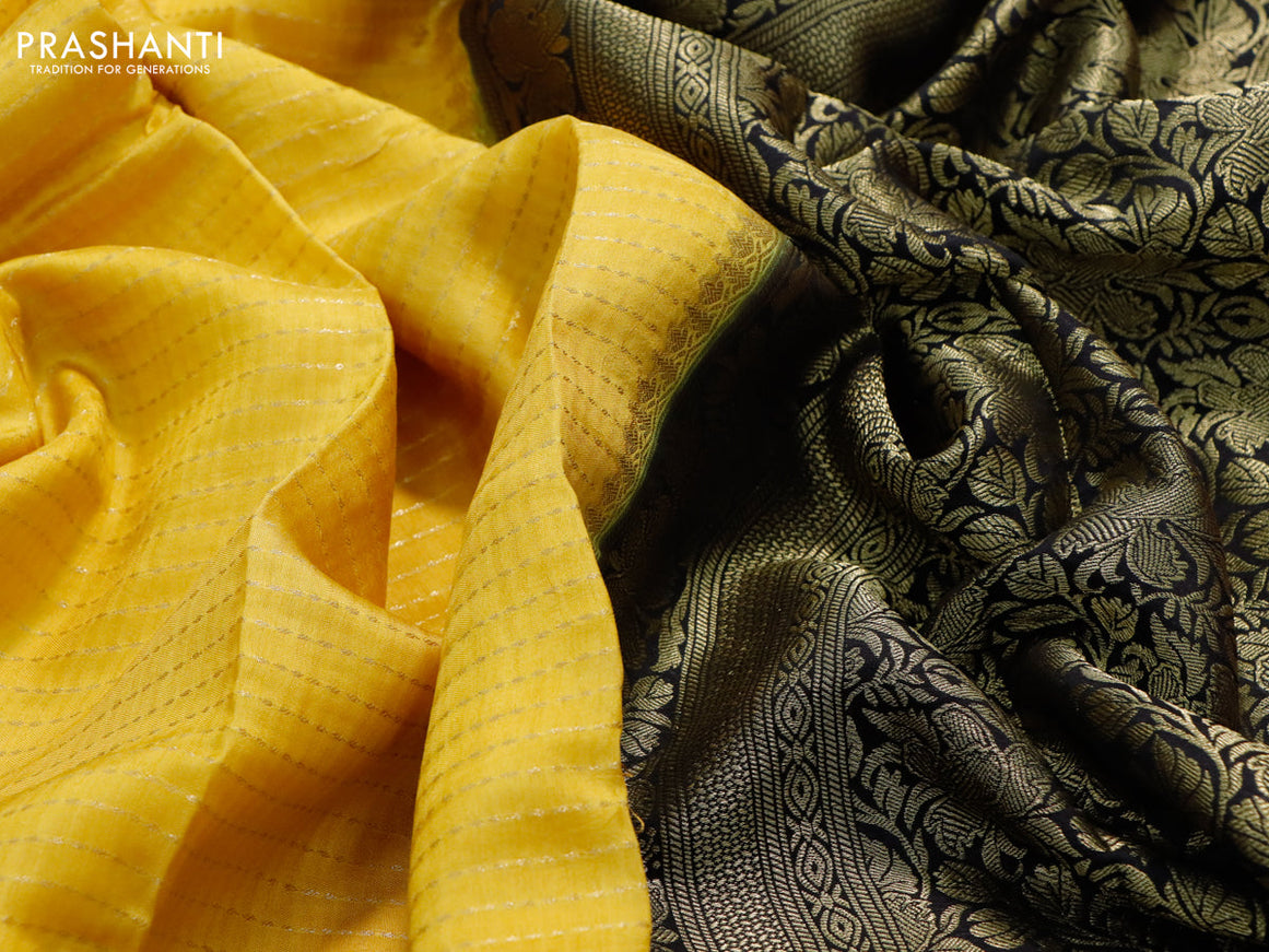 Dola silk saree yellow and bottle green with allover zari stripe weaves and zari woven border & zari butta blouse