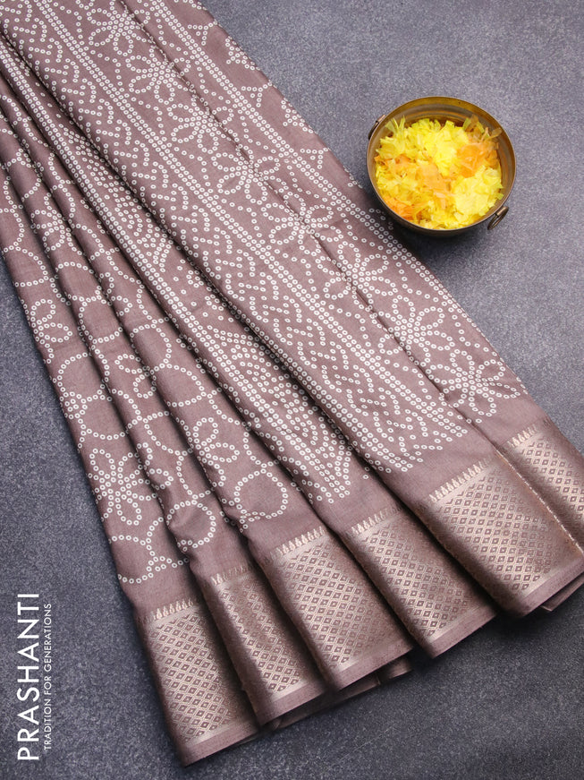 Semi dola saree pastel brown with allover bandhani prints and zari woven border