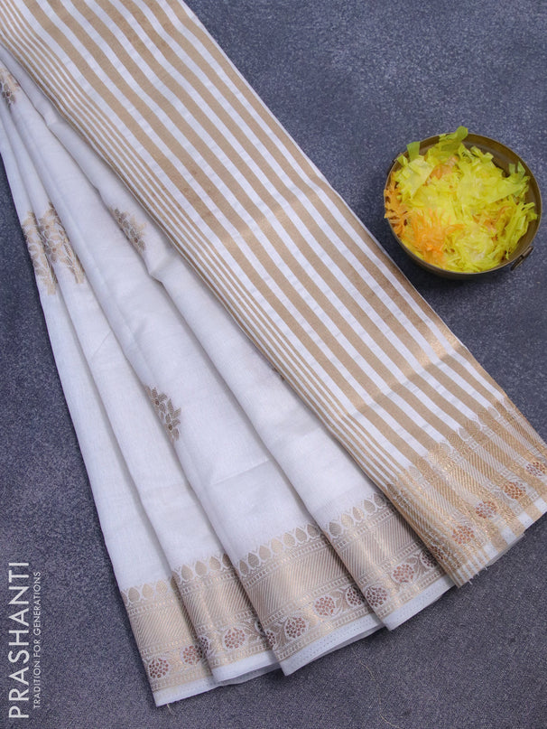 Semi raw silk saree off white with floral zari woven buttas and zari woven border