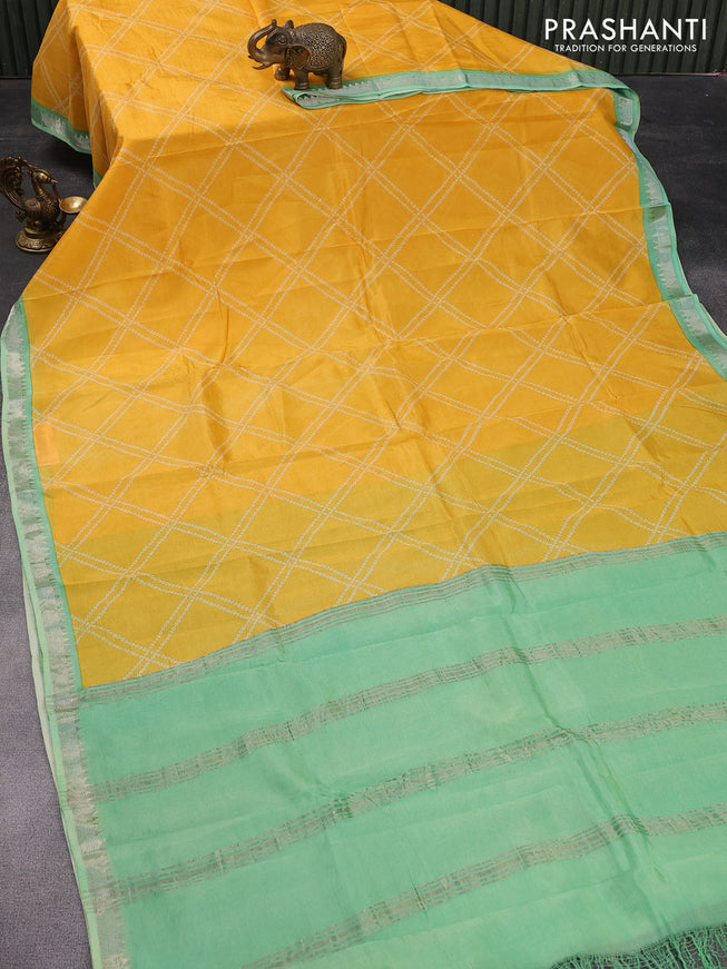 Mangalgiri silk cotton saree mango yellow and teal green with allover bandhani prints and silver zari woven border