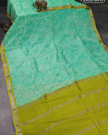 Mangalgiri silk cotton saree teal green and light green with allover bandhani prints and silver zari woven border