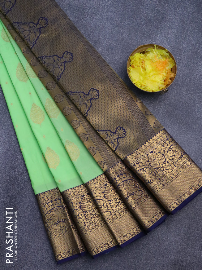 Semi kanjivaram silk saree green shade and navy blue with zari woven buttas and zari woven korvai border