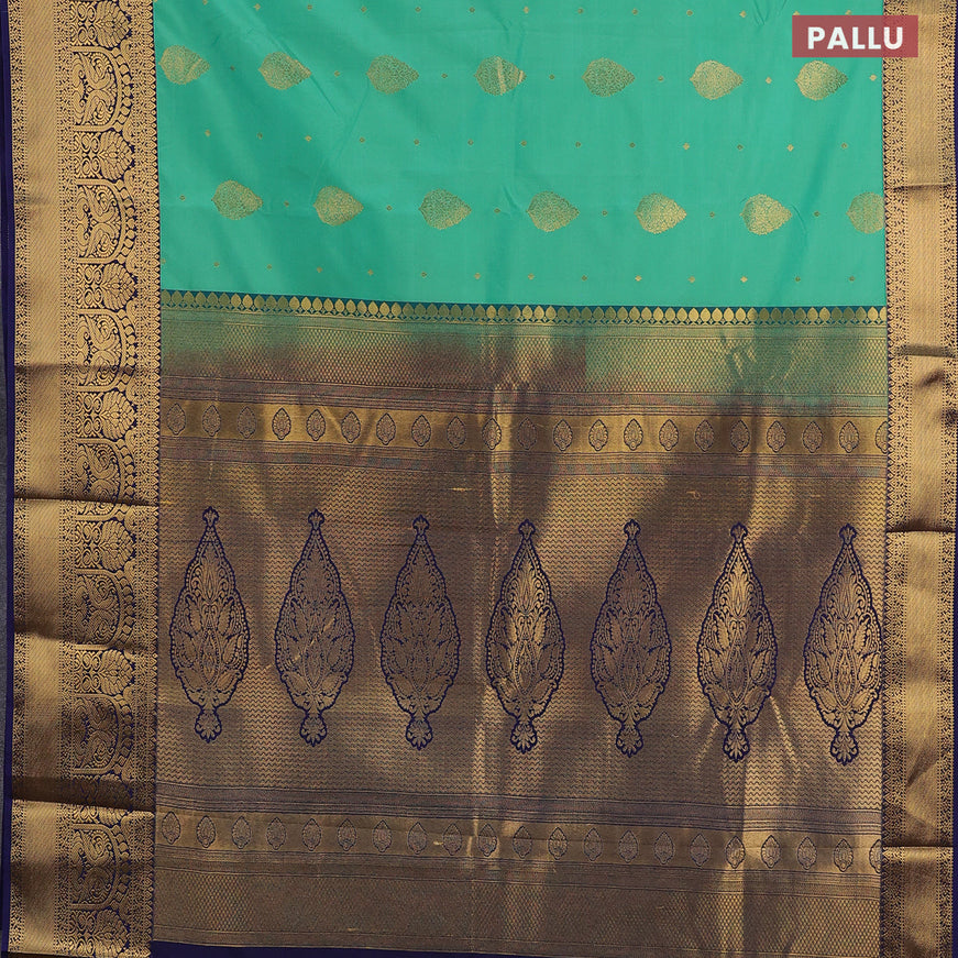 Semi kanjivaram silk saree green shade and navy blue with zari woven buttas and zari woven korvai border
