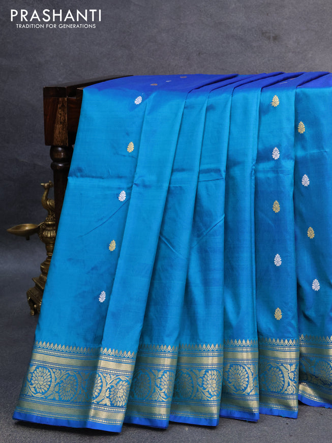 Banarasi katan silk saree dual shade of cs blue with silver & gold zari woven buttas and zari woven floral border
