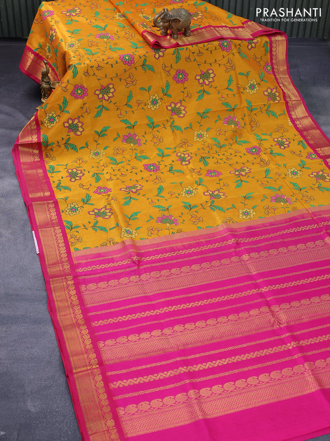 Silk cotton saree mango yellow and pink with allover floral prints and paisley zari woven korvai border