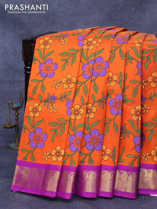 Silk cotton saree orange and purple with allover floral prints and paisley zari woven korvai border