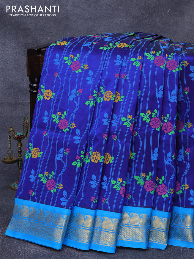 Silk cotton saree blue and cs blue with allover floral prints and paisley zari woven korvai border