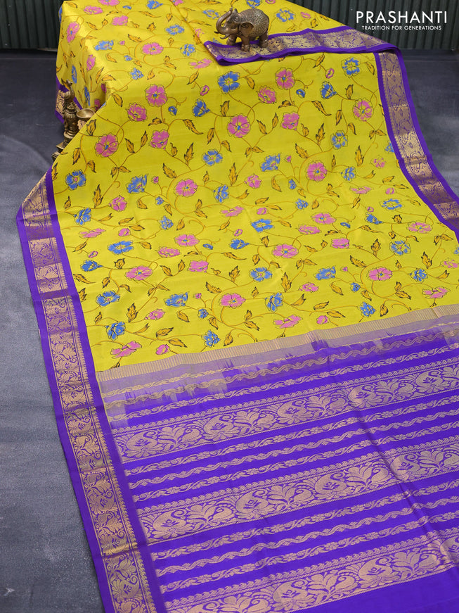 Silk cotton saree yellow and violet with allover floral prints and zari woven korvai border